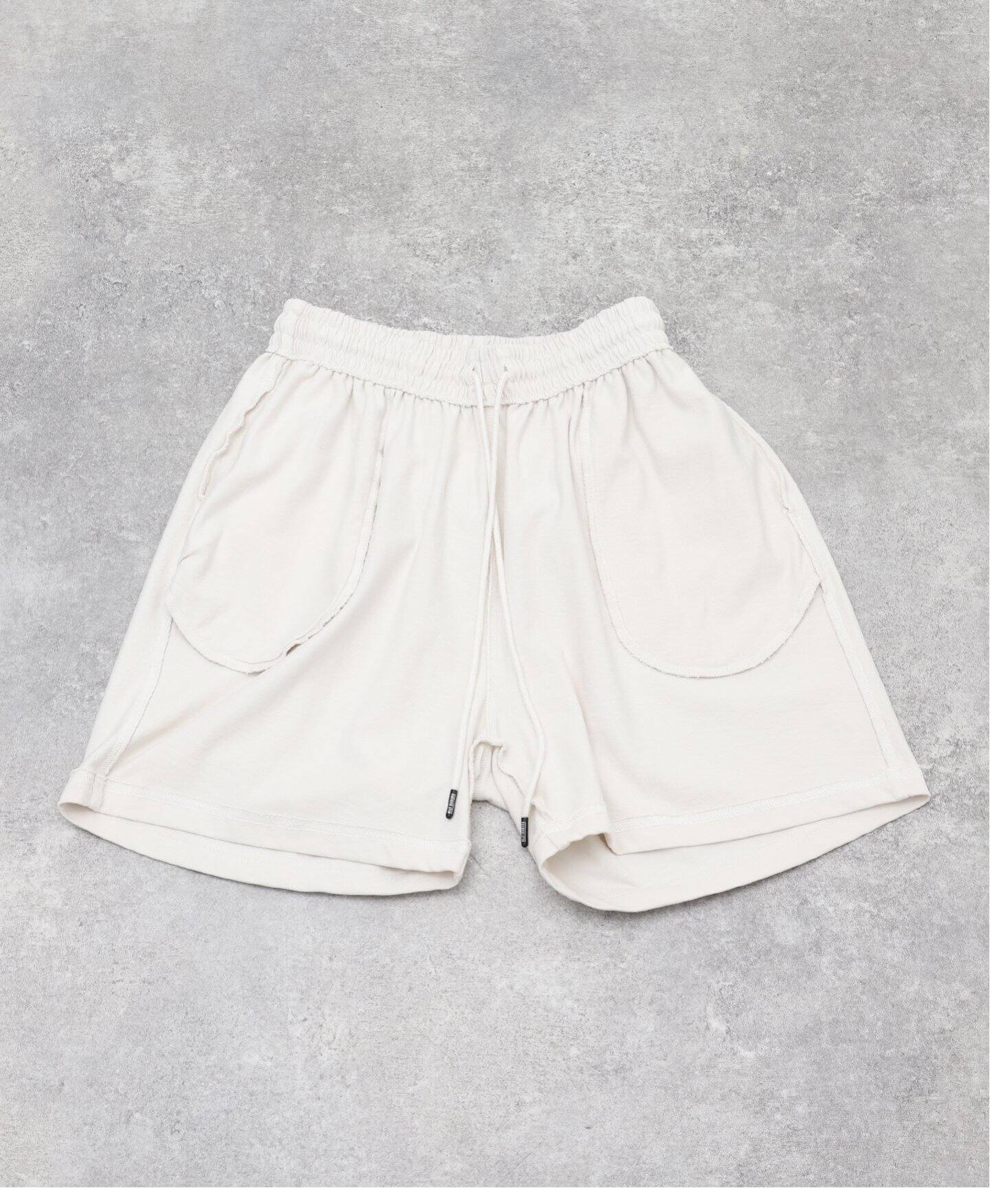 WILLY CHAVARRIA × WISM」GYM SHORTS