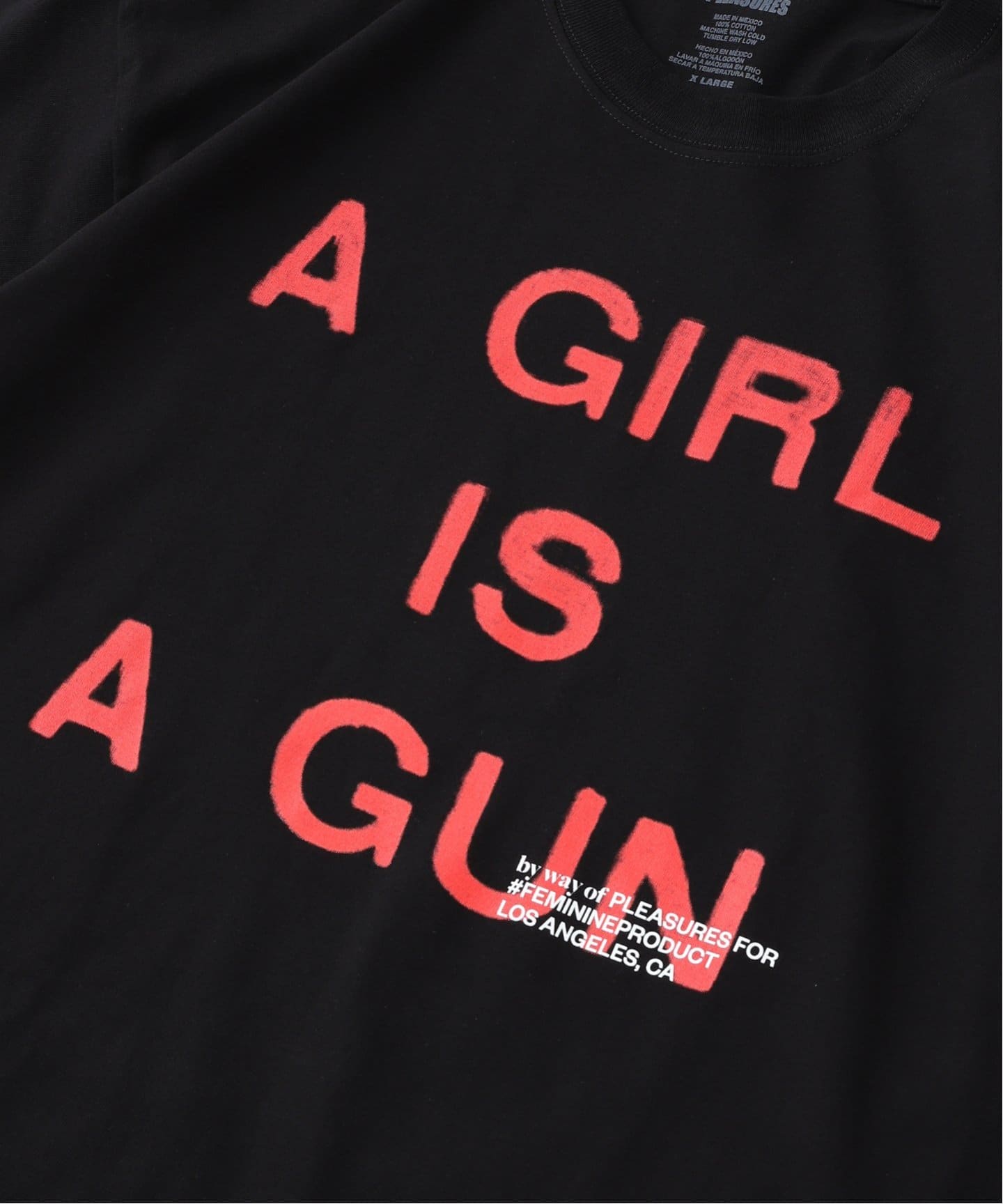 PLEASURES / プレジャーズ GIRL IS A GUN T-SHIRT（Tシャツ