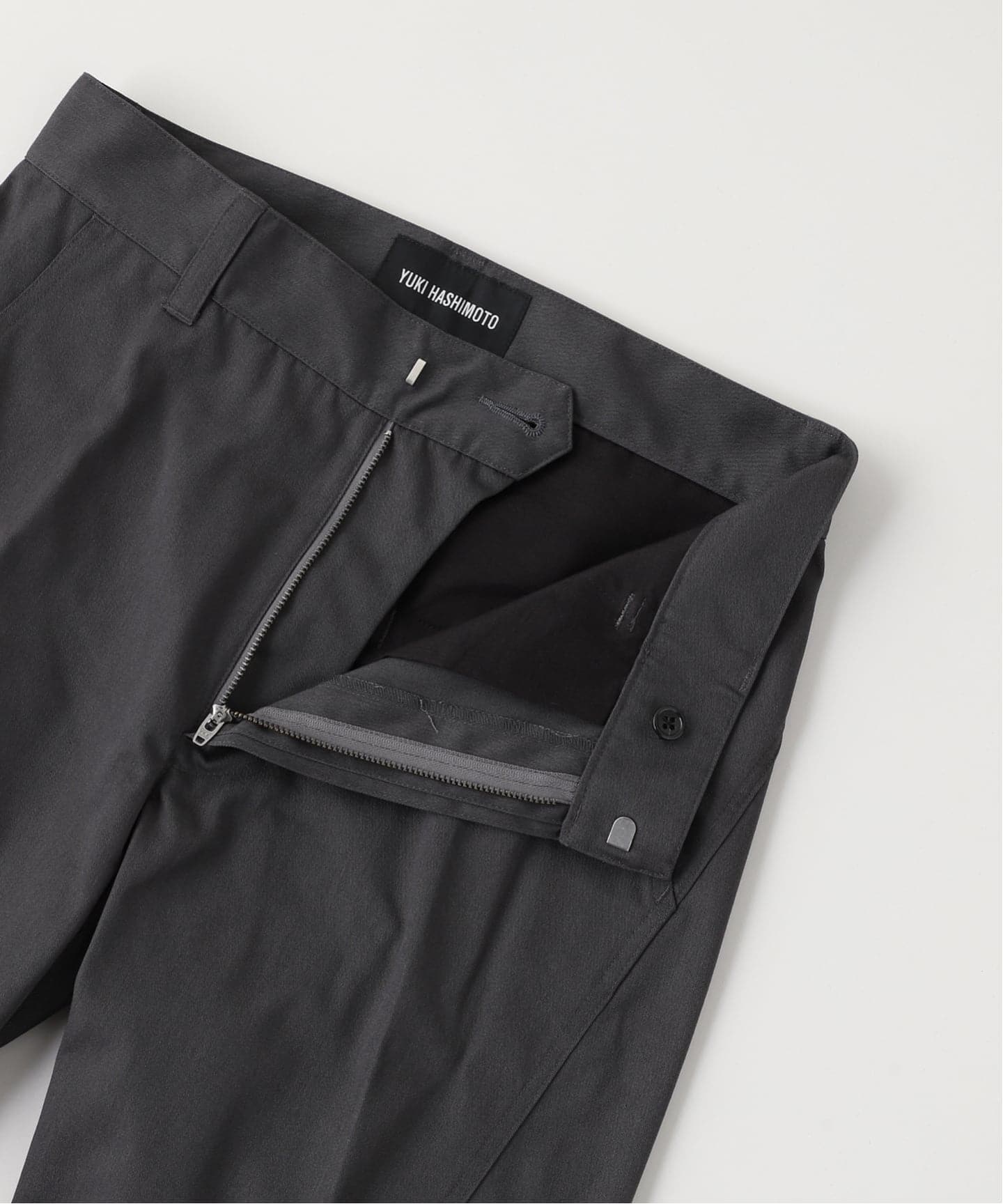 YUKI HASHIMOTO / ユウキハシモト TWISTED FLARED PANTS（スラックス